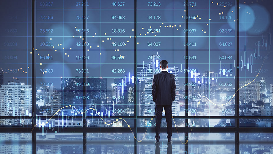 Man looking over buildings at night time in a city with superimposed images of numbers and charts