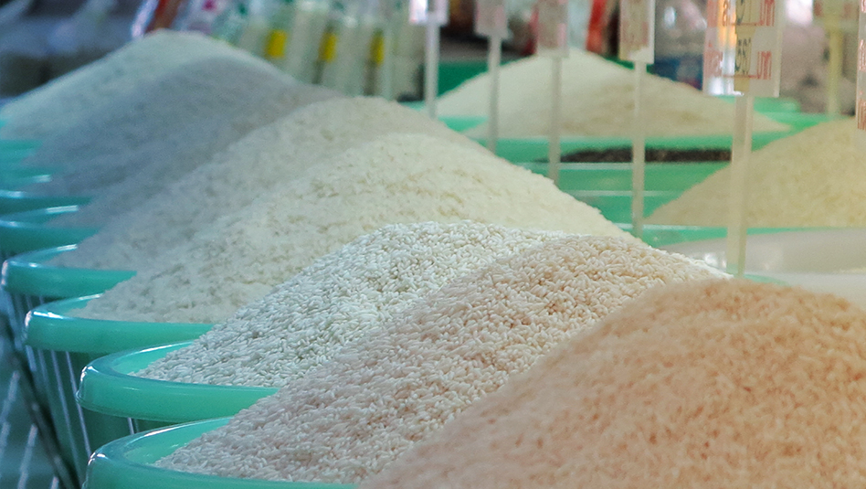 White rice on green colored tubs.