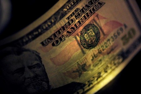 Dollar eases after hitting highest in two weeks, US job data looms