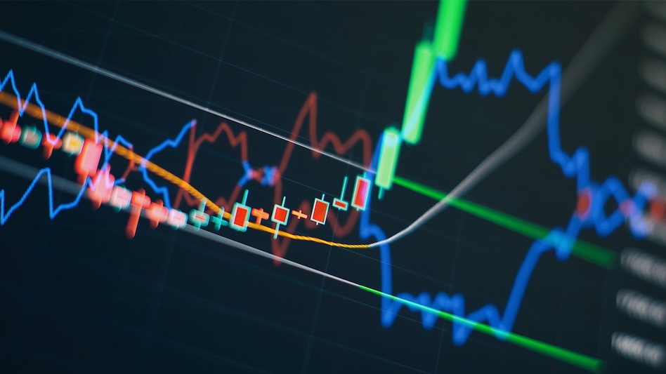 Candle stick and line chart on a dark computer screen