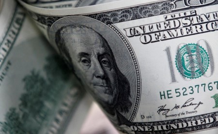Dollar bides time as markets brace for Ukraine summit