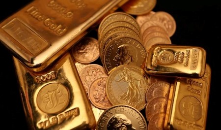 Gold trims losses after US inflation data; set to end nine-week win streak