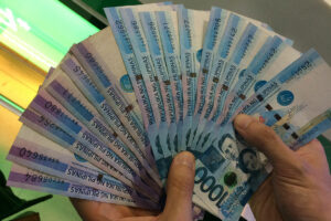 Peso jumps on dovish Fed, trade woes