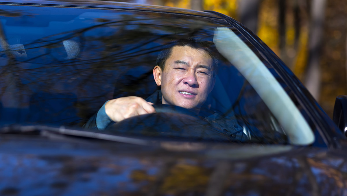 A man driving a car