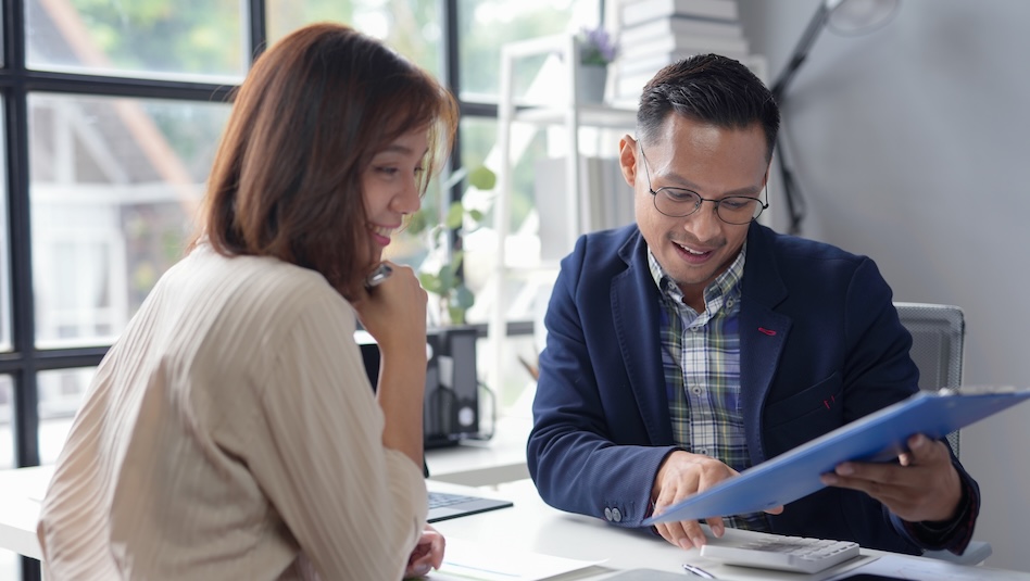Man and woman reviewing a document